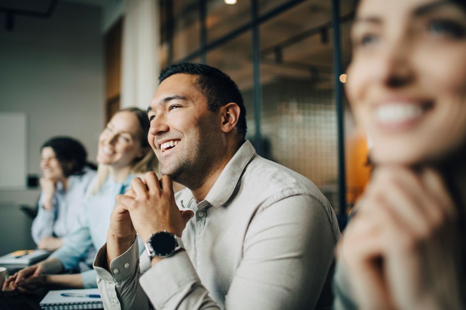 Professionals in a business meeting collaborating on customer experience and digital service strategy
